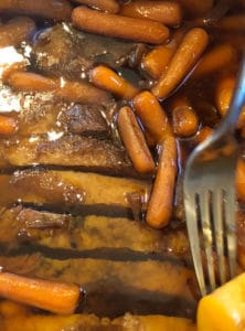 Instant Pot Brisket sliced and back in pot with carrots and potatoes