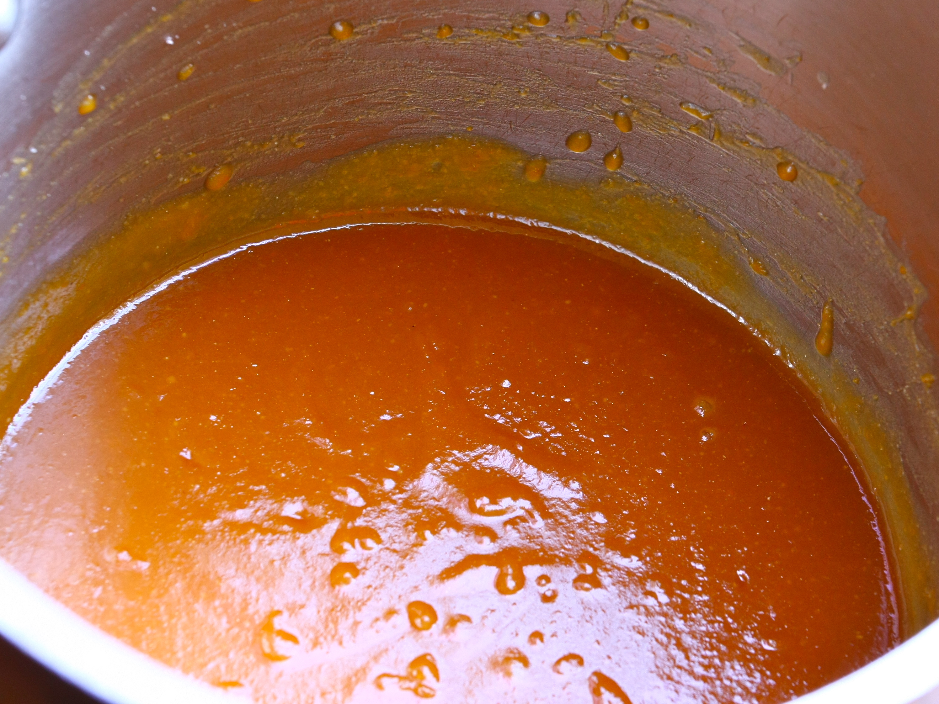A saucepan of the red marinade, coming to a boil. 