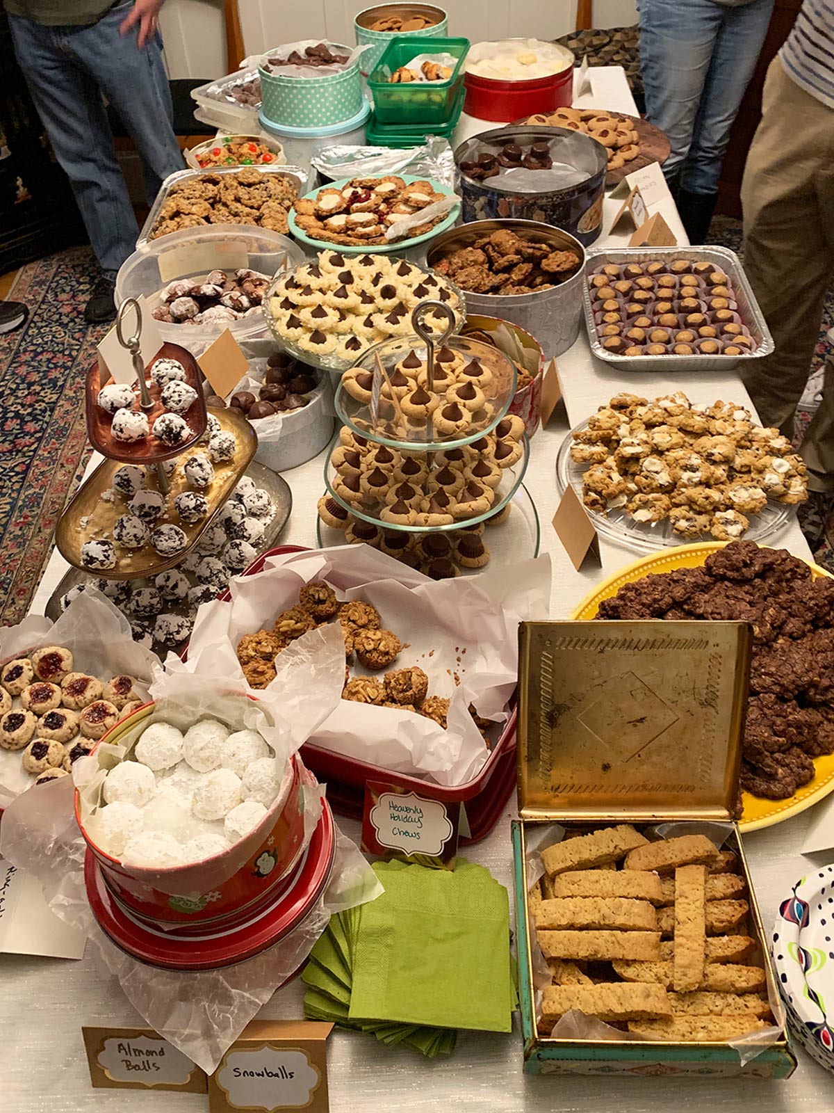 A view of a large table of cookies at a cookie party where we continue the legacy and cherish Hermine's baking memories.