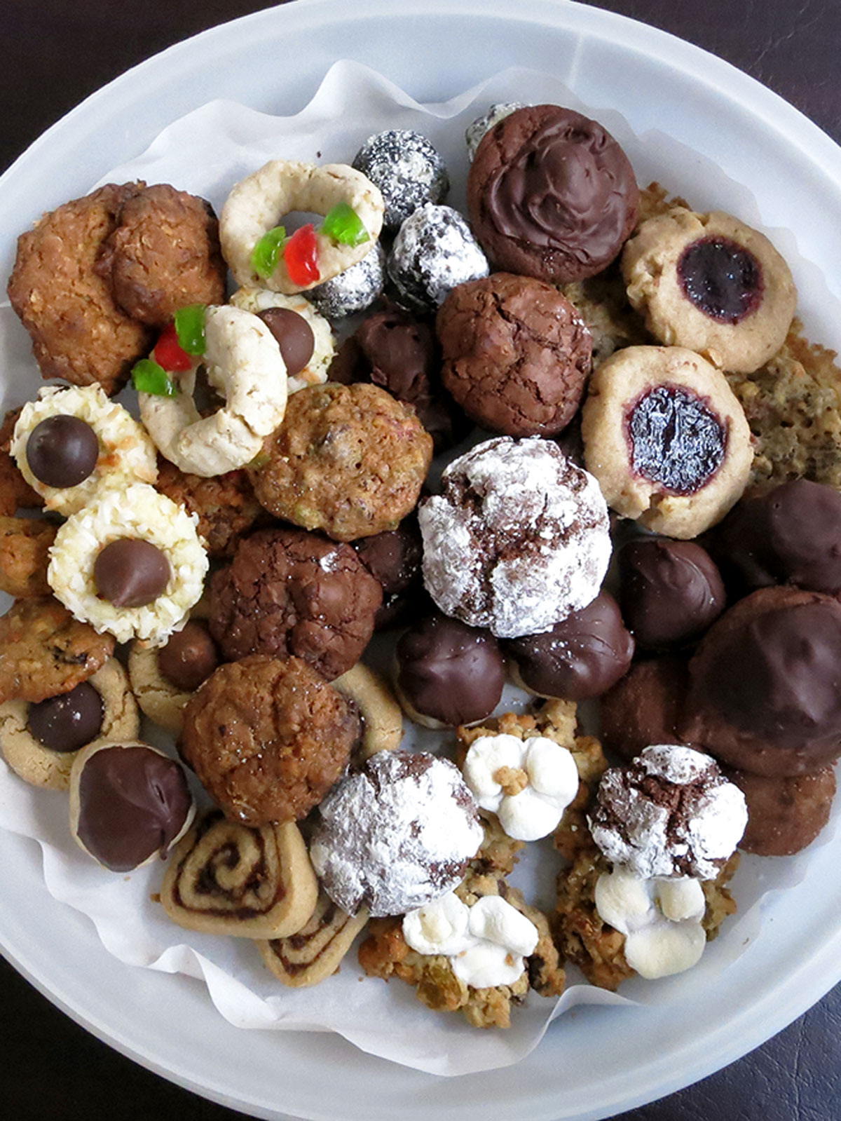 Top down view of a tupperware full of cookies from a cookie party.
