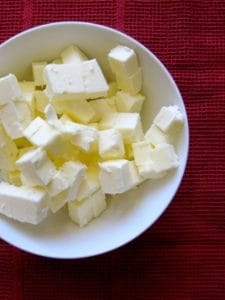 pie dough prep: butter cut into cubes and placed in a white bowl
