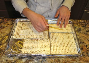 Placing matzoh in the pan