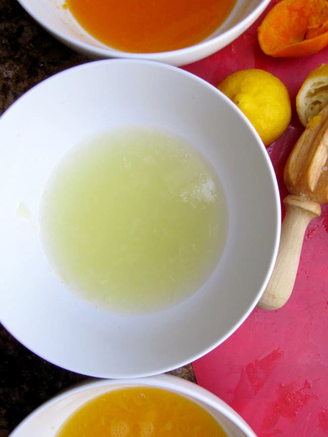 lemon, lime, tangerine juices for sangrita in white bowls