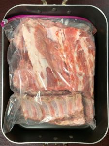 bourbon soaked baby back ribs in plastic bag
