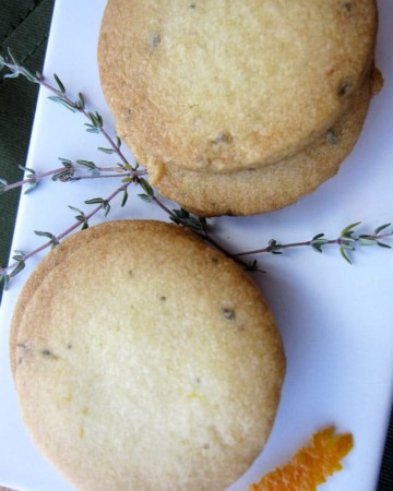 orange thyme cocktail cookies on white plate