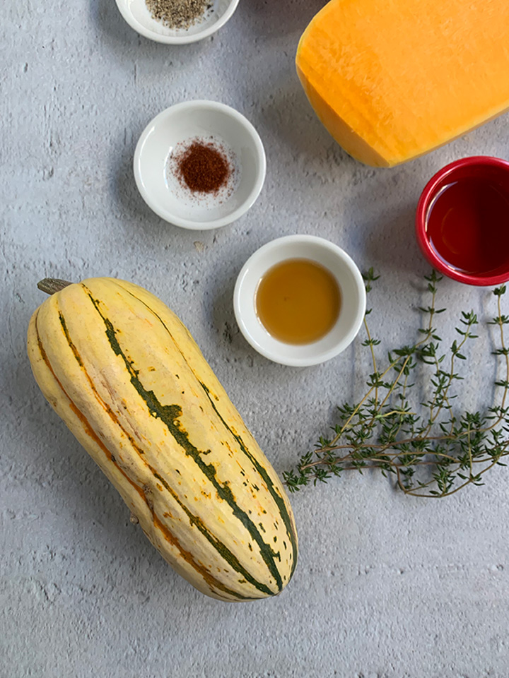 whole delicata squash with a few of the other wellington ingredients showing