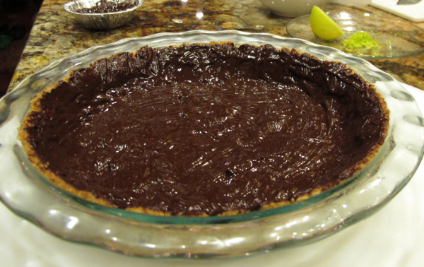 Macadamia crust covered with melted chocolate.