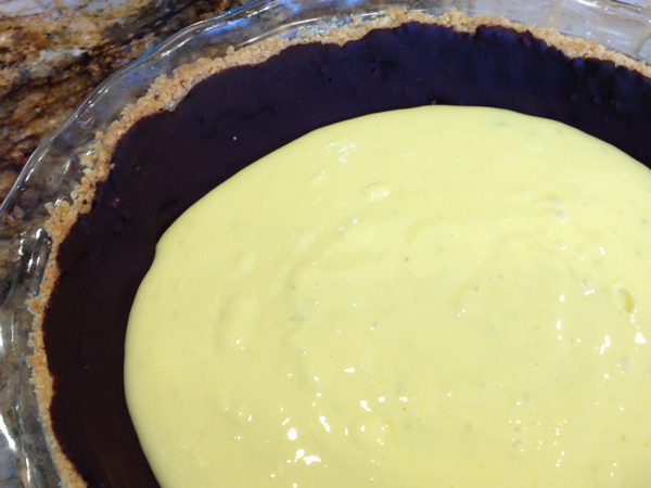Filling poured into chocolate lined macadamia crust.