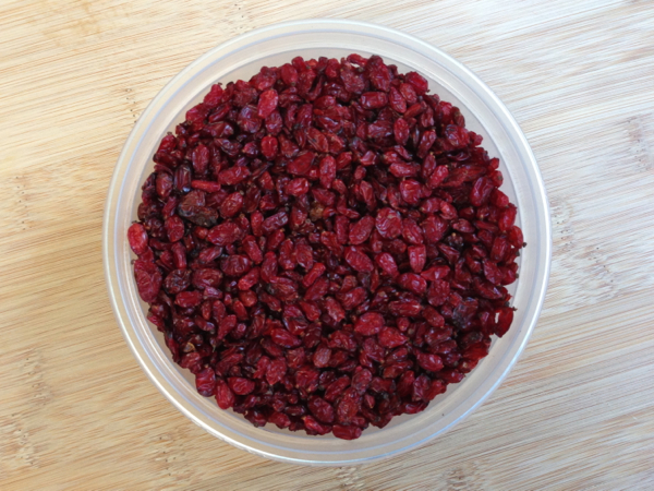 A white bowl of barberries.