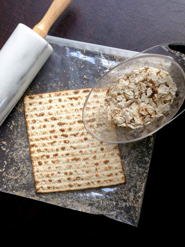 Matzo farfel kugel photo showing rolling pin and matzo boards being made into matzo farfel