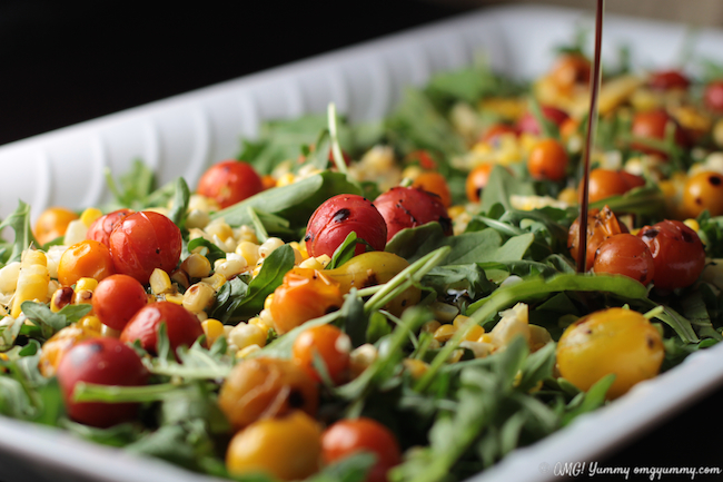 Close up of finished Blistered Tomato, Corn, and Arugula Salad ready for serving.