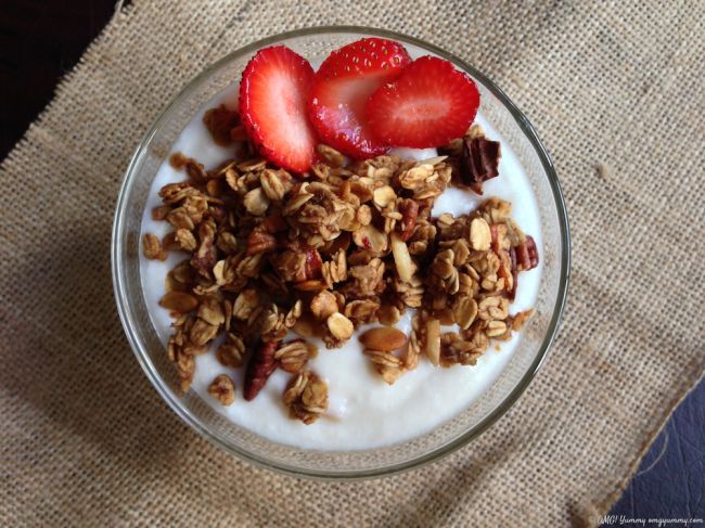 Granola with fresh fruit, yogurt and date syrup.