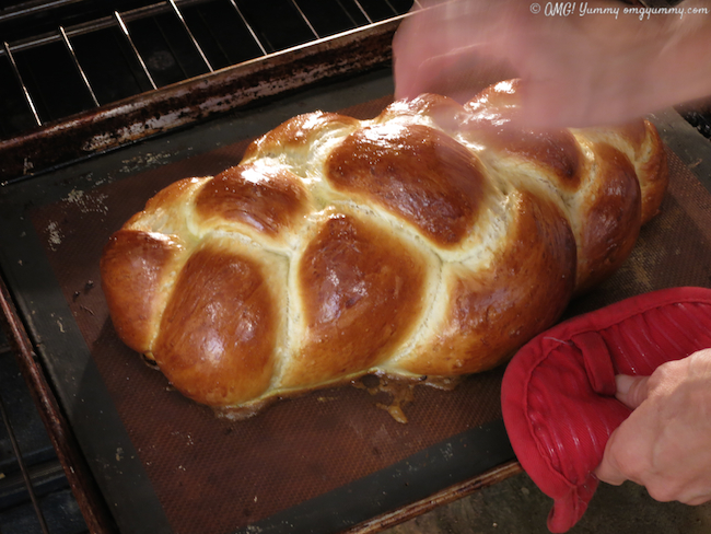 Fresh baked challah coming out of the oven.