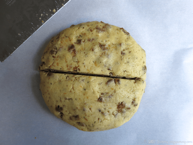 Fig Cocktail Cookie dough in a disk, cut in half.