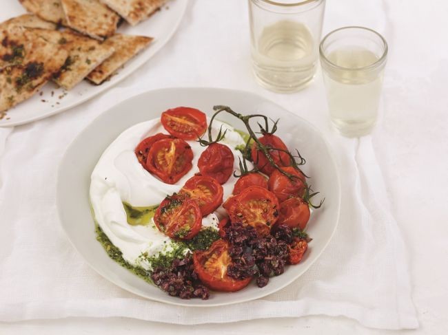A gorgeously simple appetizer from Cheryl Sternman Rule's "Yogurt Culture" featuring labneh (yogurt cheese), roasted tomatoes, tapenade, and pistachio pesto - a multi-cultural masterpiece of flavors.
