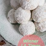 snowball cookies on powder sugared plate