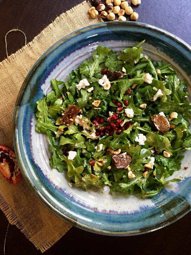 arugula and fig salad in blue bowl