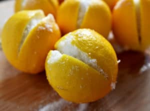 Ottolenghi Preserved Lemons closeup of lemon with slit and salt