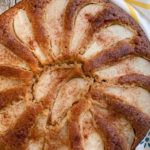 pin image with whole cake and pear