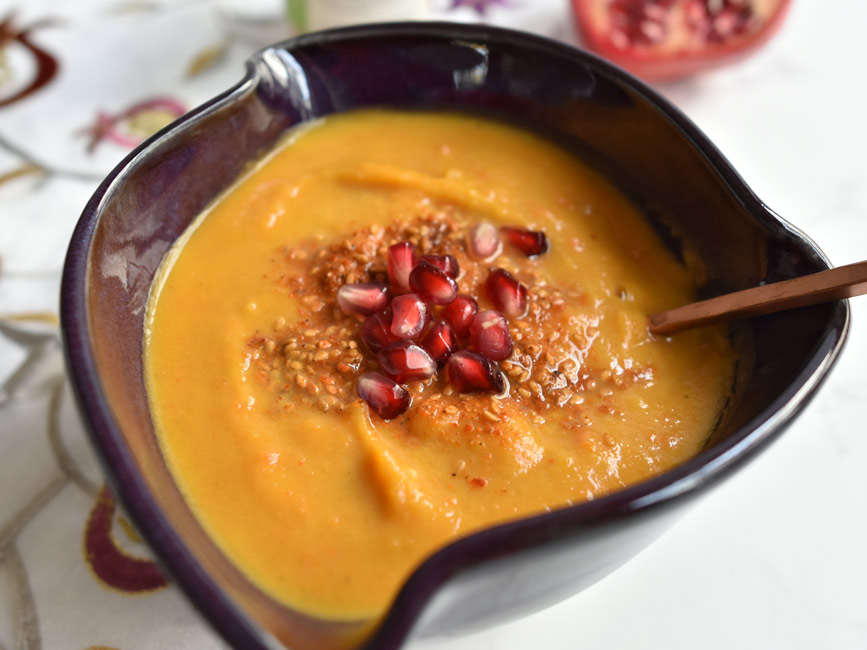 Close up of roasted butternut squash soup in bowl.
