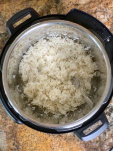 cooked basmati rice in instant pot fluffed by fork