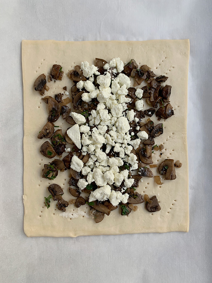 goat cheese layered on to the mushrooms on the puff pastry