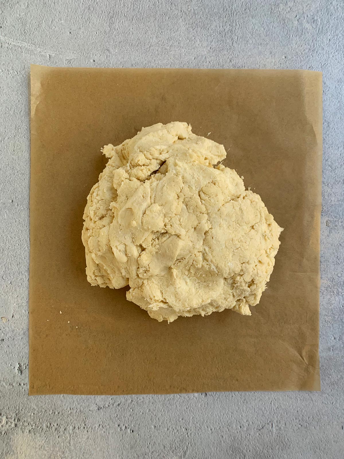 Finished dough on parchment ready to separate into individual portions.