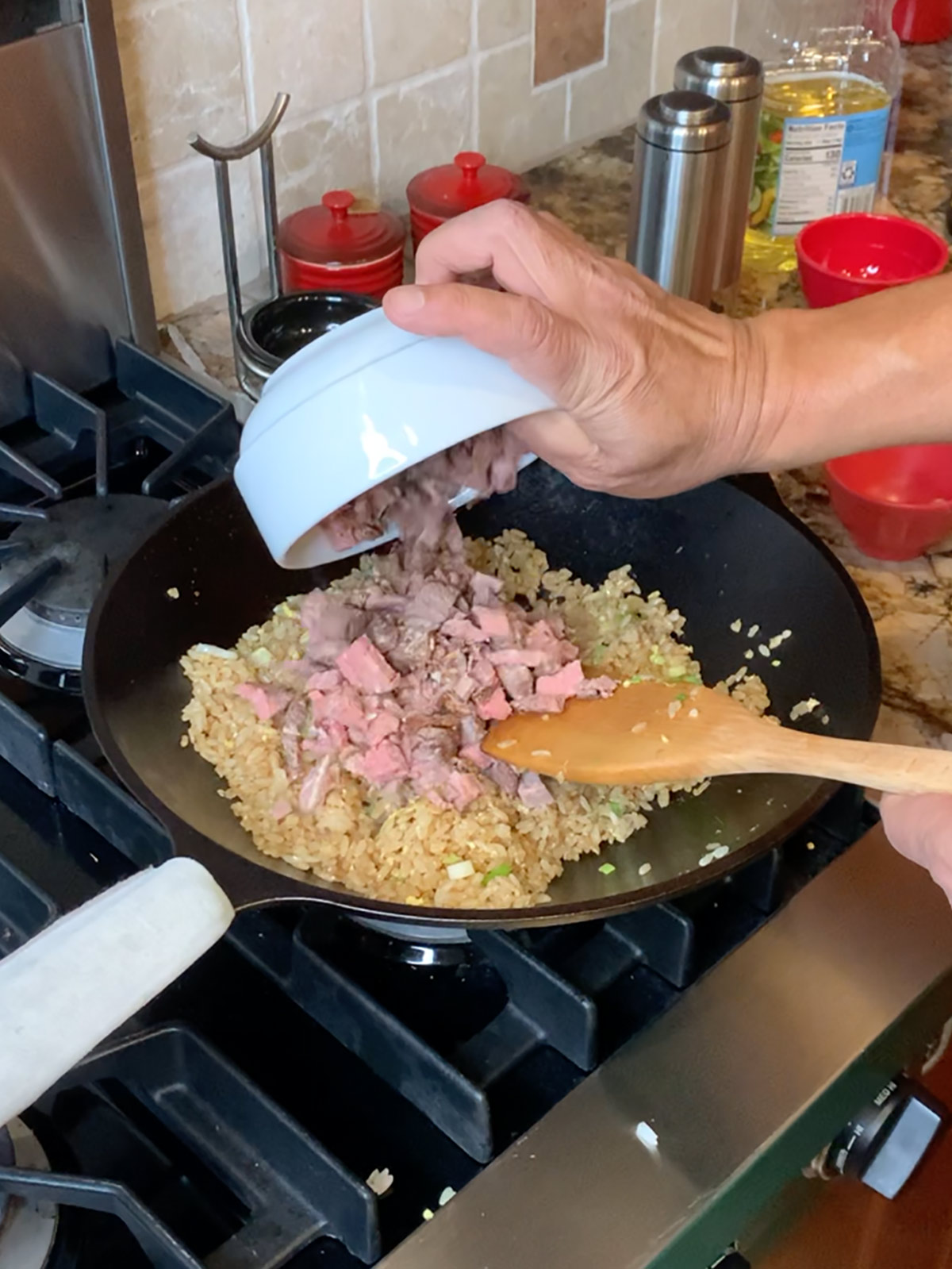 Finally add prime rib to fried rice mixture in wok.