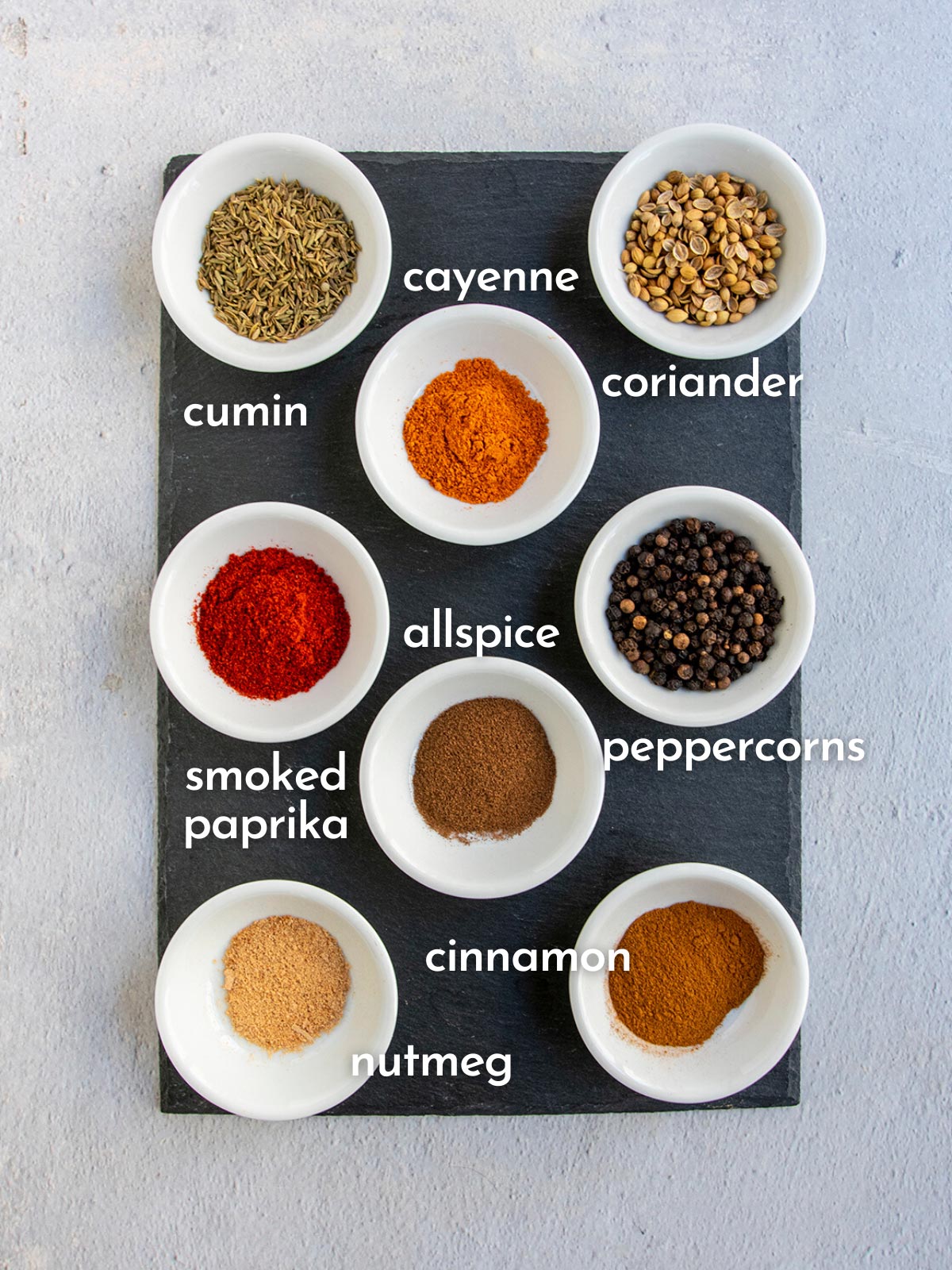 Ingredient shot showing all spices needed for baharat seasoning.