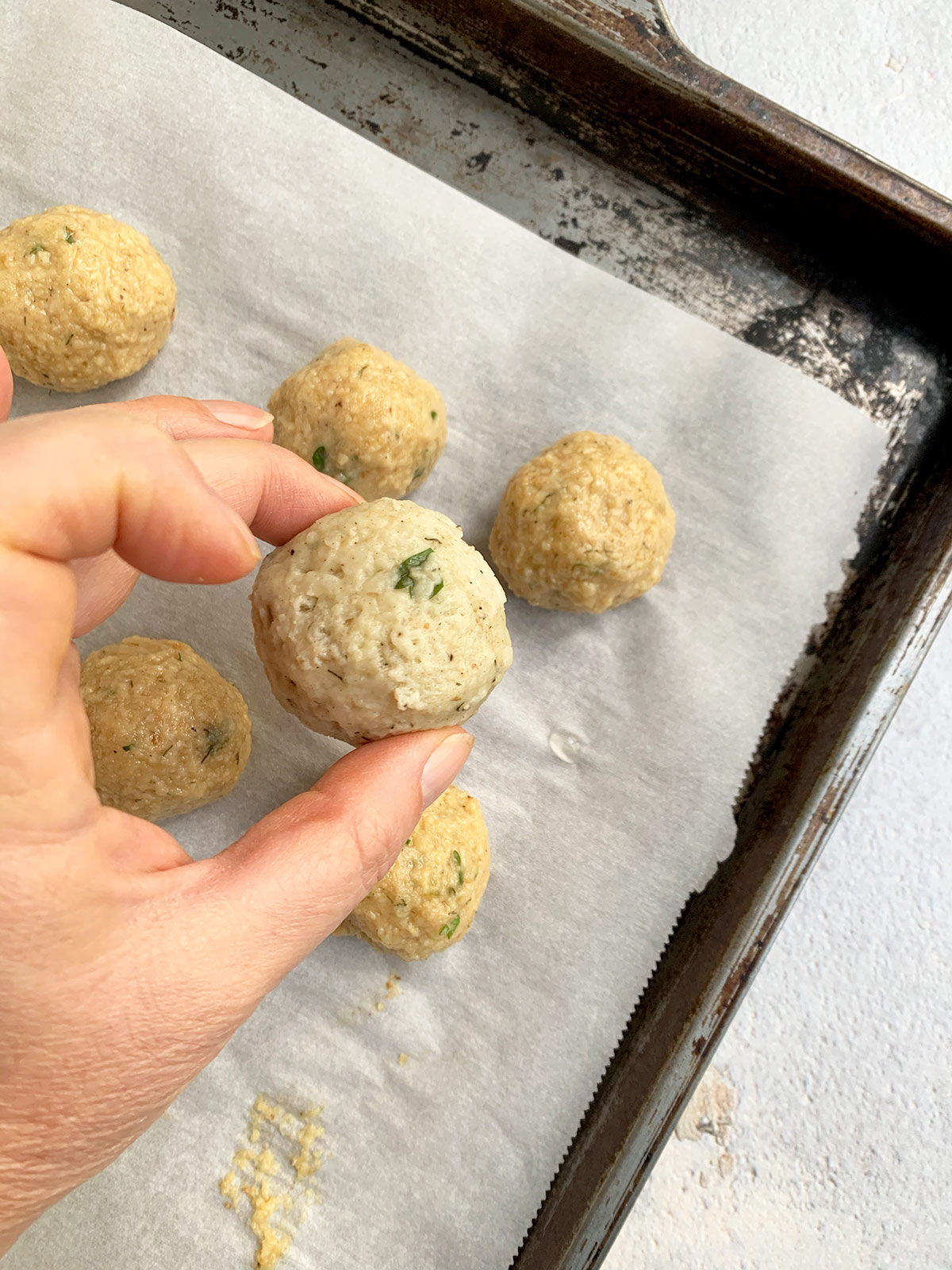 Close up of formed matzo ball ready to cook.