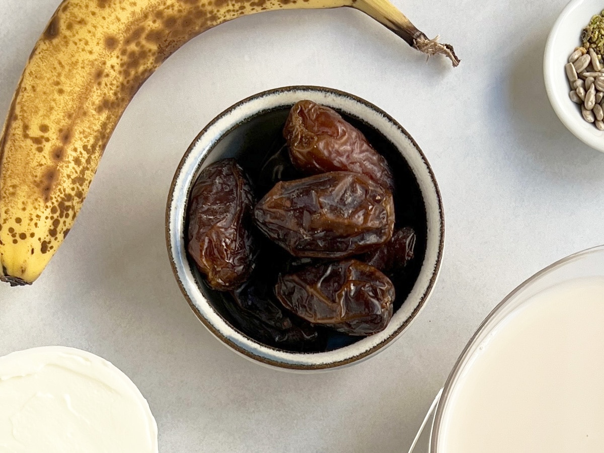 Close up of medjool dates in a bowl.