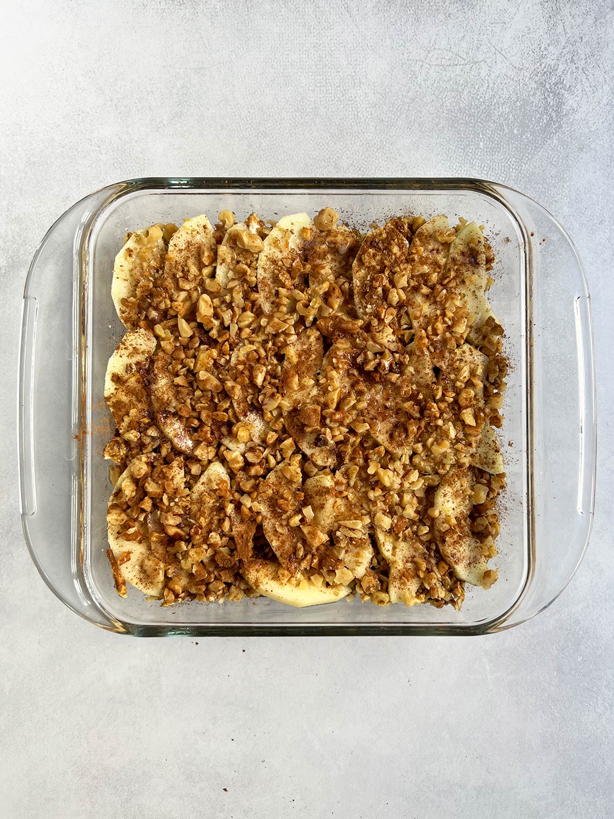 Matzo farfel kugel in glass pan ready to bake.