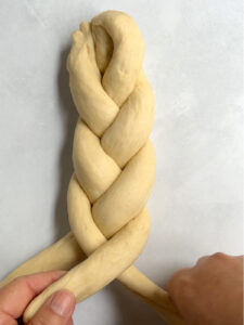 To demonstrate challah braiding, we now see a 3-strand braid almost complete.