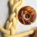 Pinterest image showing a 4-strand challah with a finished baked one.