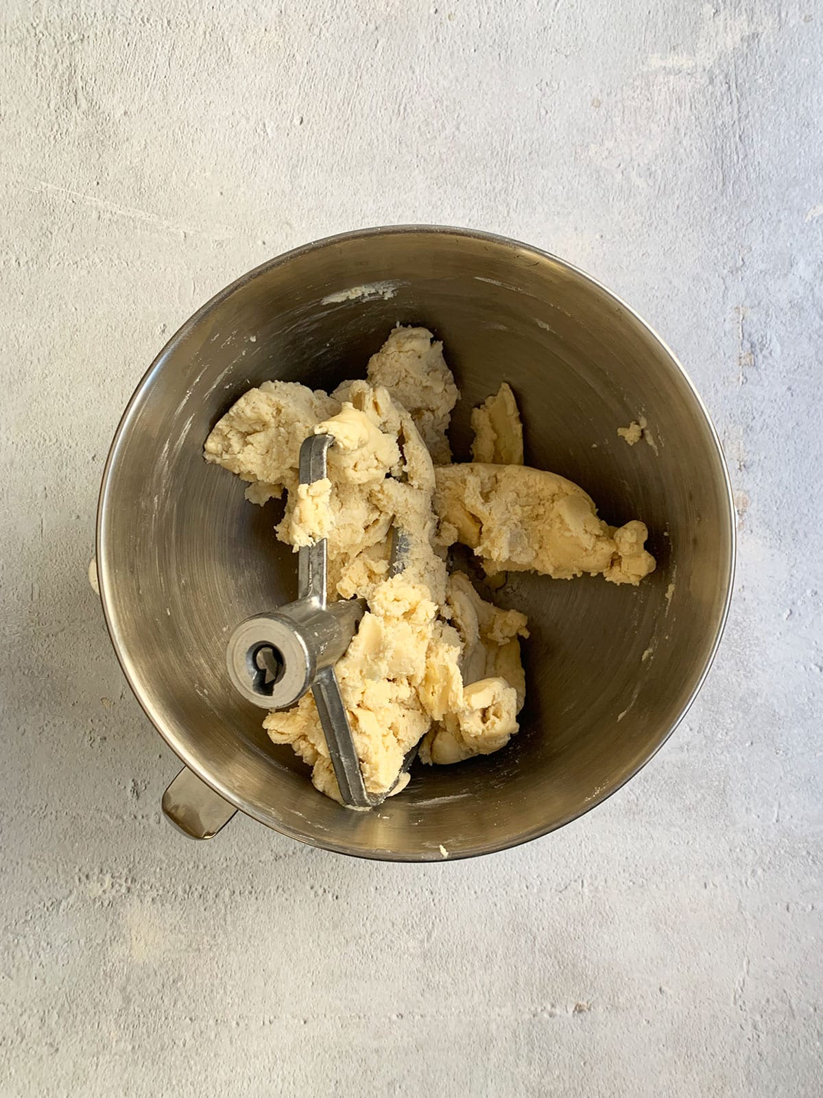 Pie dough in the stand mixer bowl after water was added and it came together.