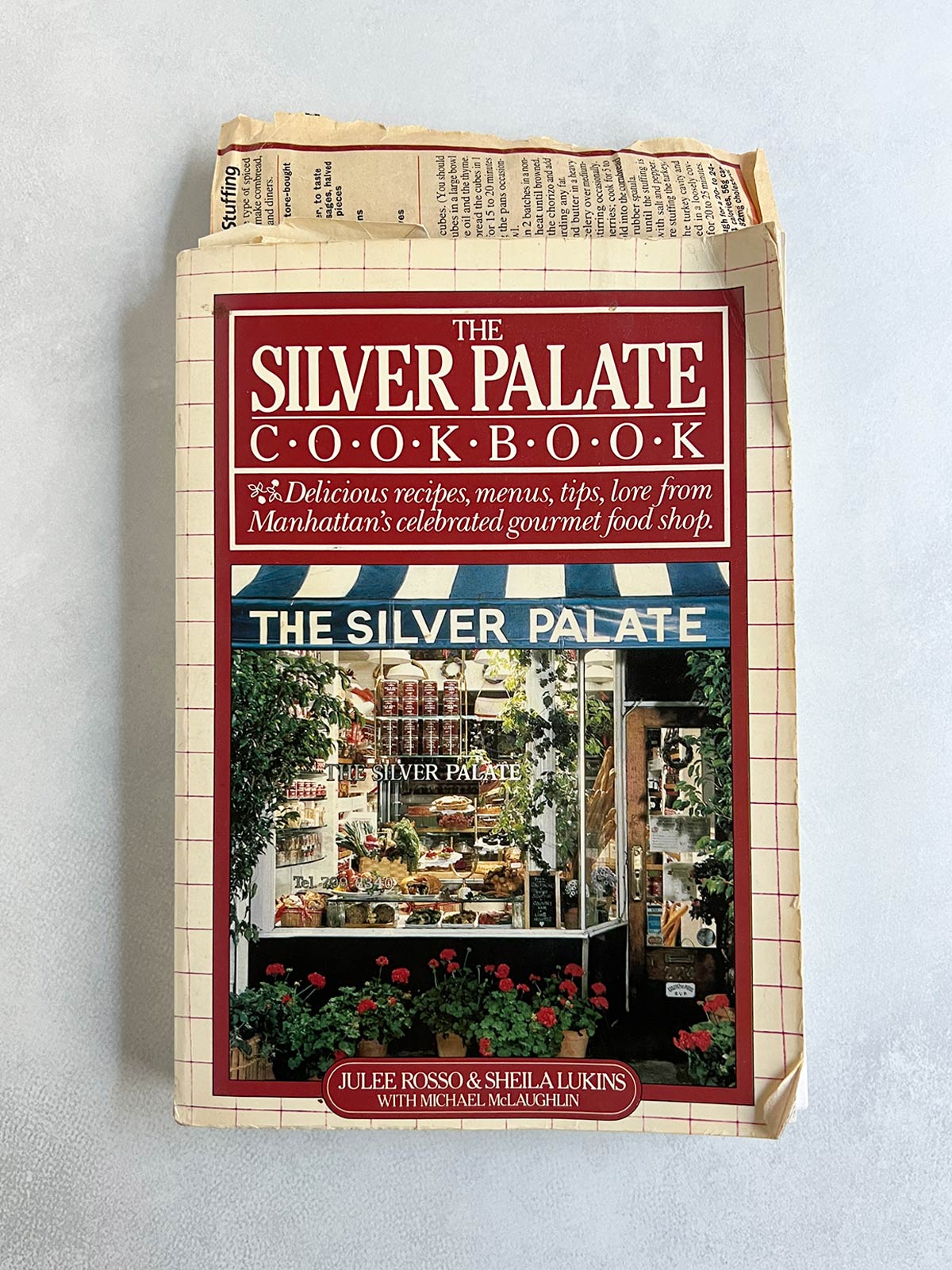 Silver Palate cookbook with miscellaneous papers sticking out of it.