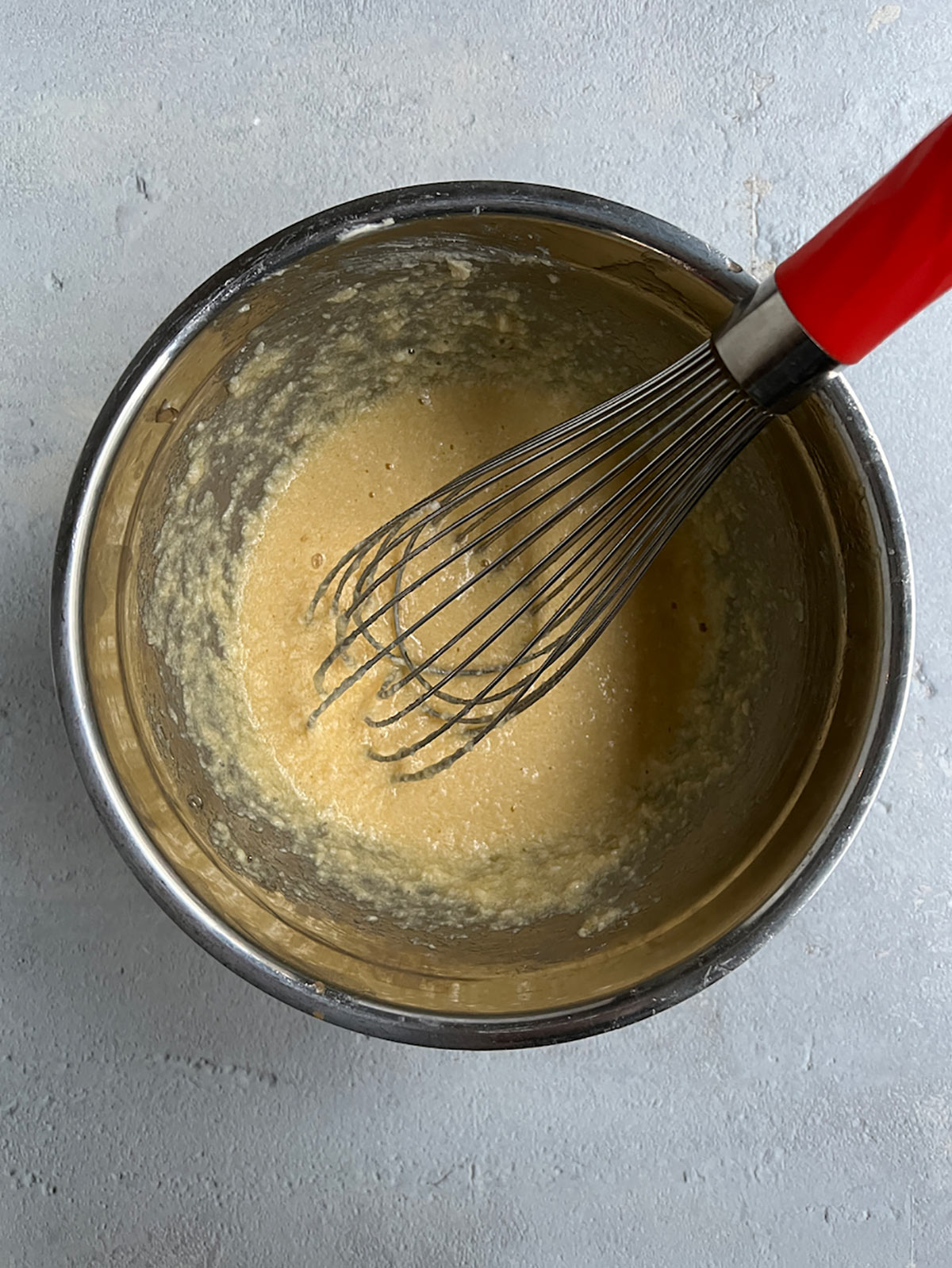 Mix eggs into creamed butter and sugar.
