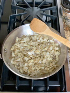Onions and za'atar cooked in the pan on the stovetop.
