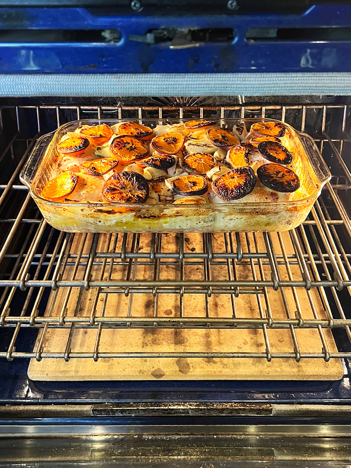 Clementine chicken roasting in the oven.