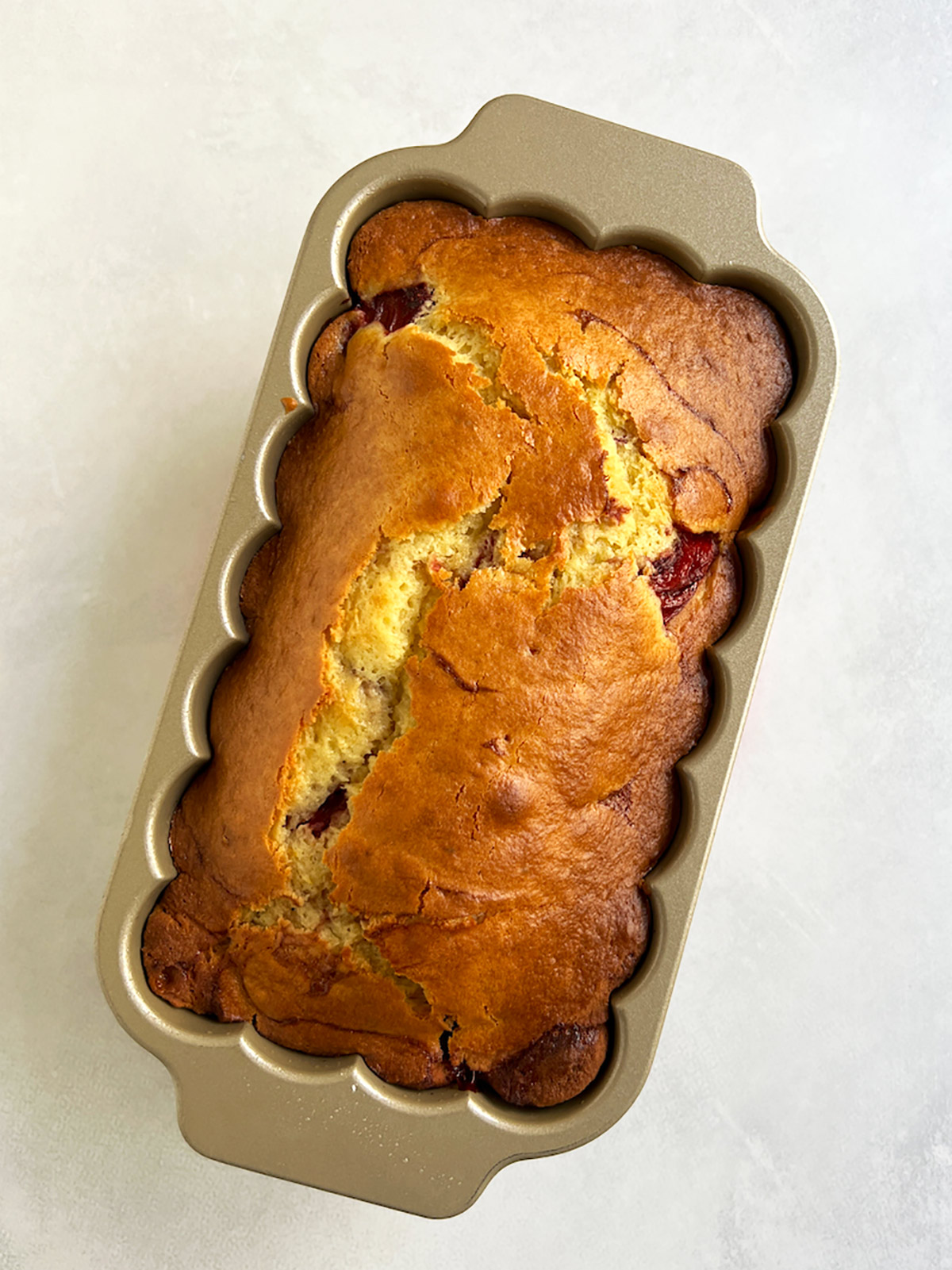 Strawberry shortcake loaf baked in pan.