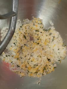 Thyme and orange zest mixed into the sugar in the mixing bowl.