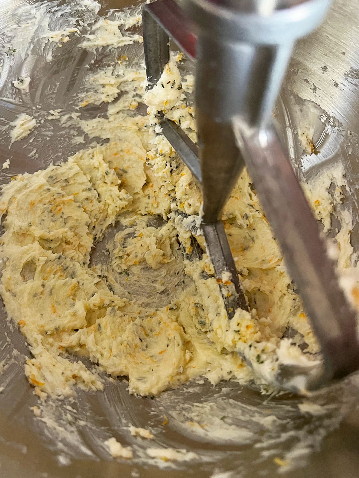Butter and sugar mixture creamed in the mixing bowl.