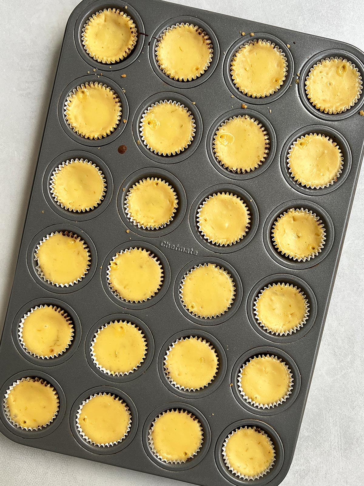 Mini key lime pie bites baked and still in cupcake pan.