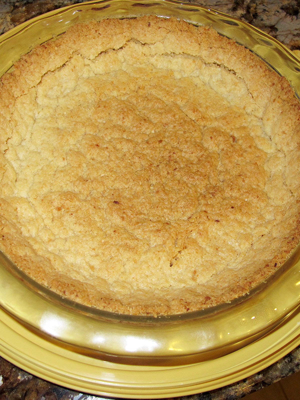 Chocolate key lime pie baked crust in a glass pan.