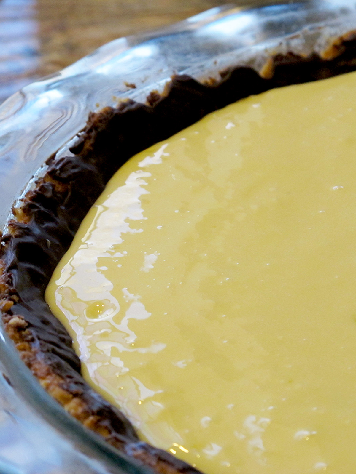 Unbaked key lime pie filling in the chocolate lined macadamia crust.