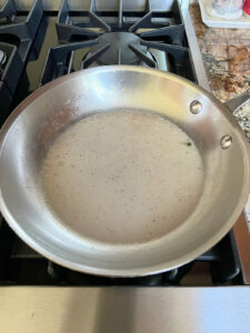 Braising liquid reduced and still in pan.