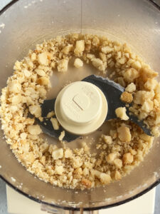 Macadamia nuts partially processed in the food processor.