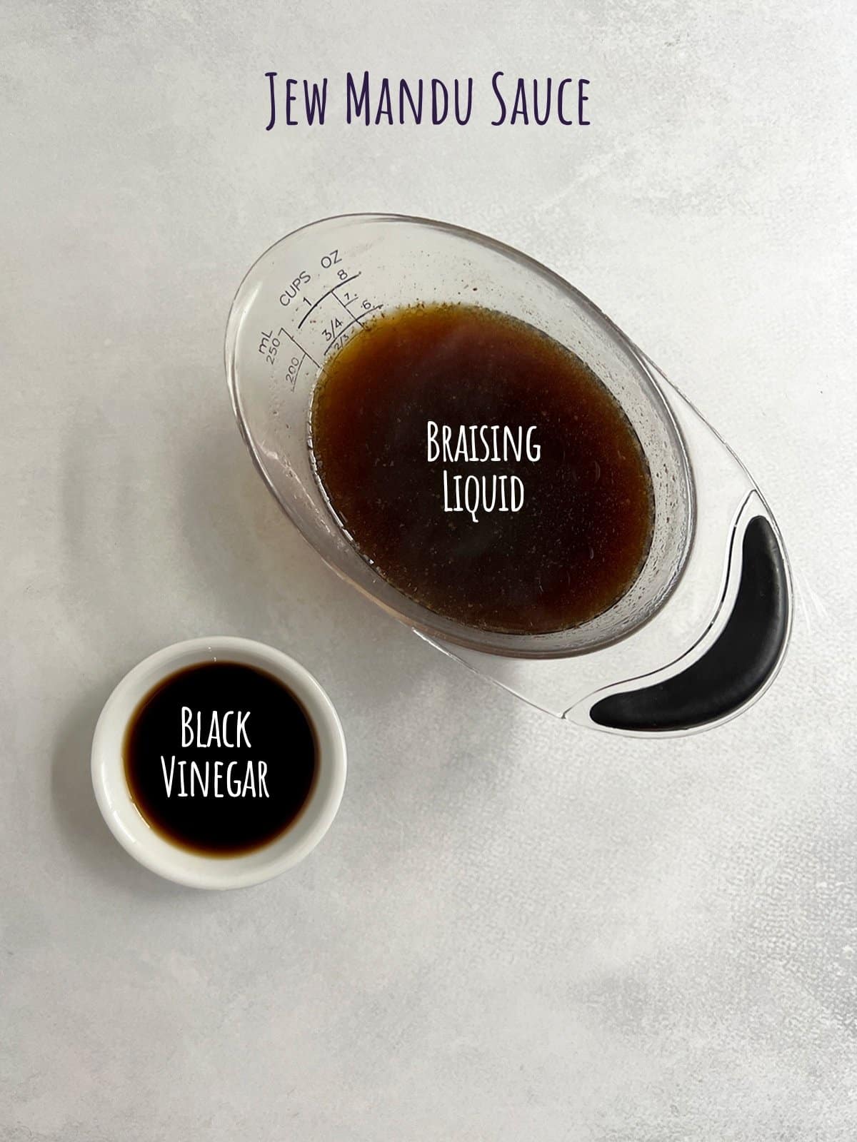 Ingredient shot for beef dumplings (jew mandu) sauce showing braising liquid and black vinegar.